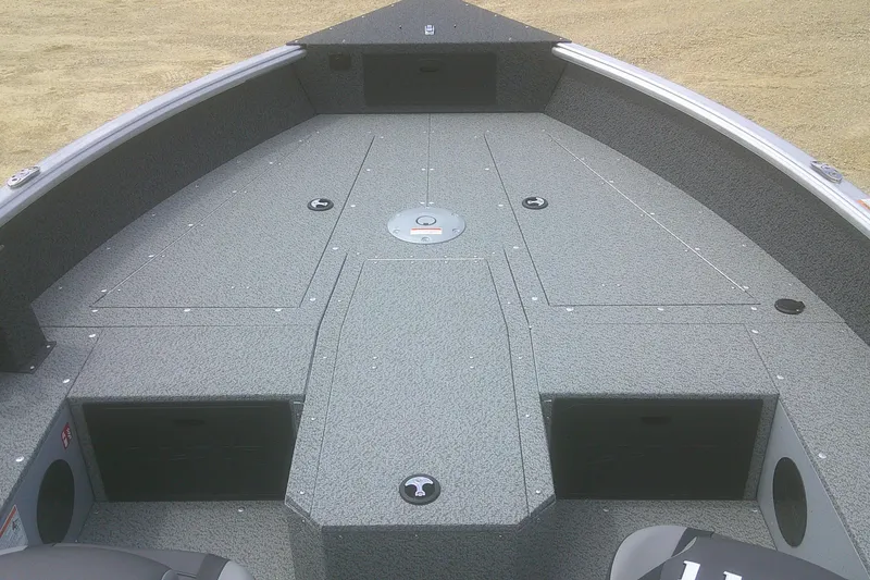 Slide: The Image of 2026 Lund 1800 Explorer Tiller boat interior with spacious deck layout. - 3