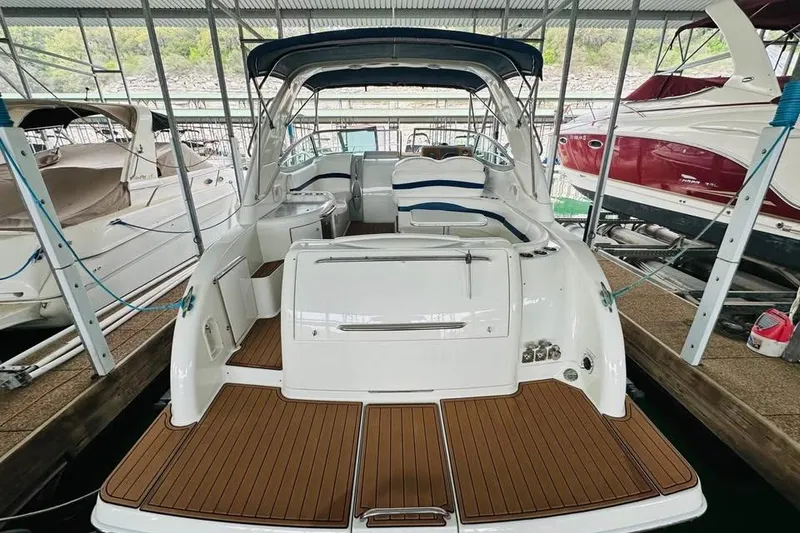 Slide: The Image of 2006 Formula 31 Performance Cruiser docked, showcasing spacious deck and seating area. - 4
