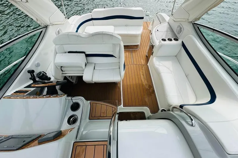 Slide: The Image of 2006 Formula 31 Performance Cruiser interior with white seating and wooden flooring. - 6