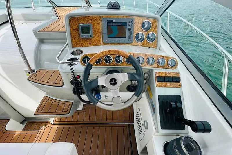 Slide: The Image of 2006 Formula 31 Performance Cruiser helm with wood accents and modern navigation equipment. - 7