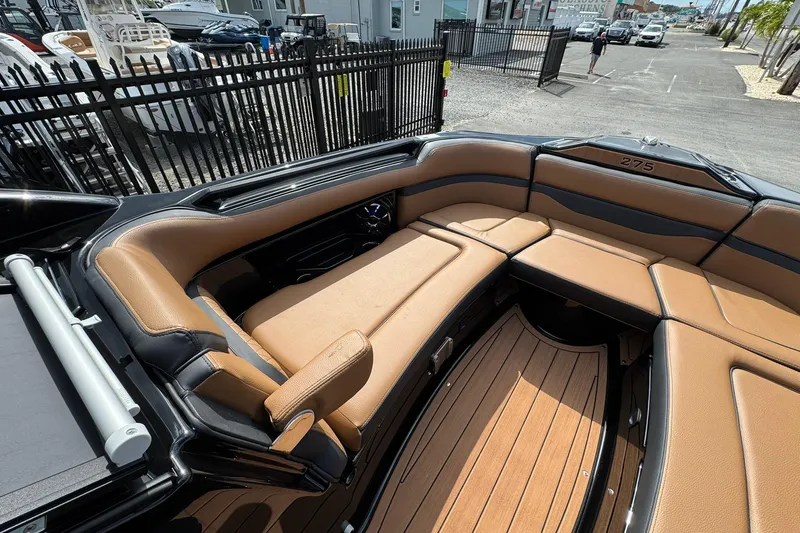 Slide: The Image of 2026 Yamaha Boats 275SD interior with tan leather seating and sleek design. - 10