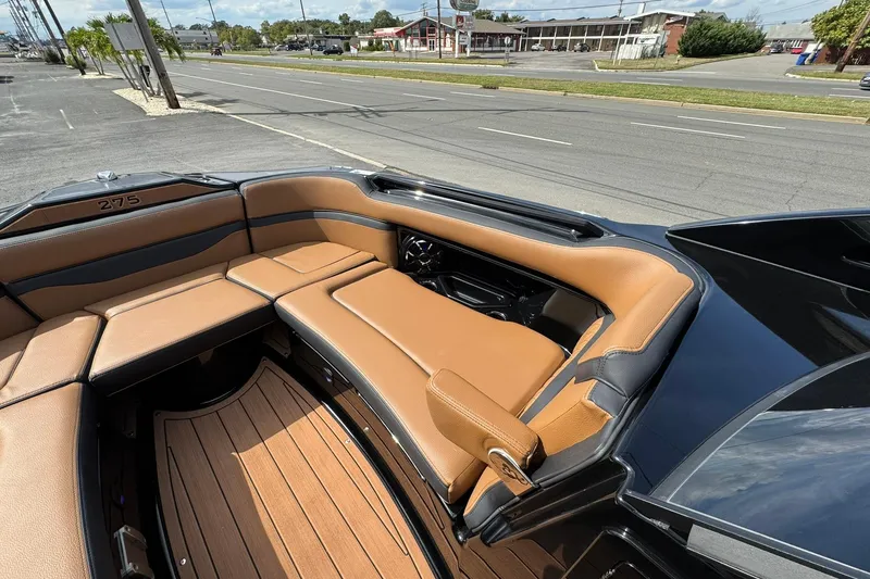 Slide: The Image of Manufacturer Provided Image: 2026 Yamaha Boats 275SD swim platform with tan seating and sleek design. - 13