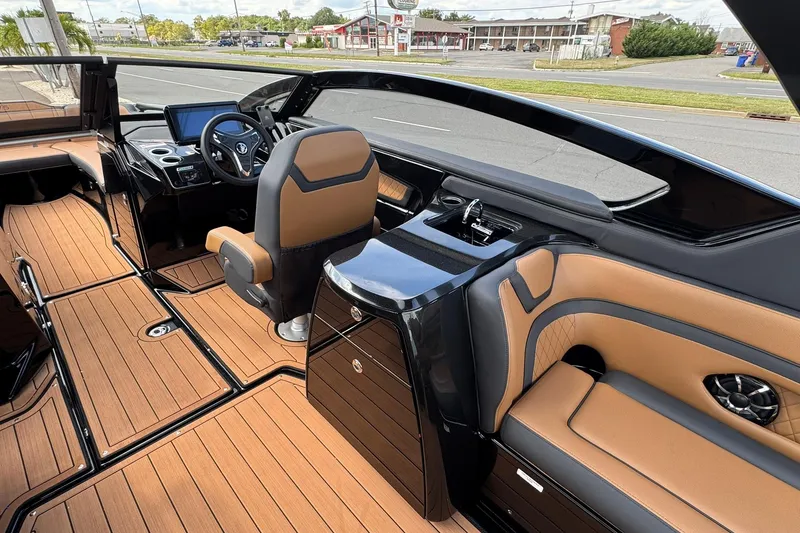 Slide: The Image of 2026 Yamaha Boats 275SD interior with tan seating and sleek design. - 20