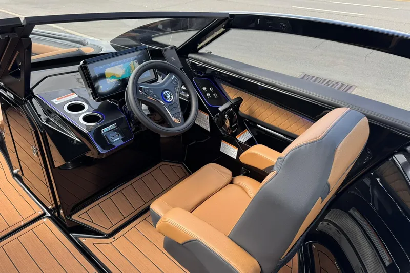 Slide: The Image of Manufacturer Provided Image: 2025 Yamaha Boats 275SD close-up on water, showcasing sleek design and model emblem. - 22