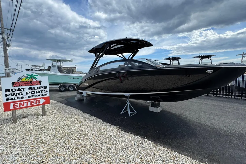 Slide: The Image of Manufacturer Provided Image: 2026 Yamaha Boats 275SD luxury interior with tan seating and sleek design. - 26