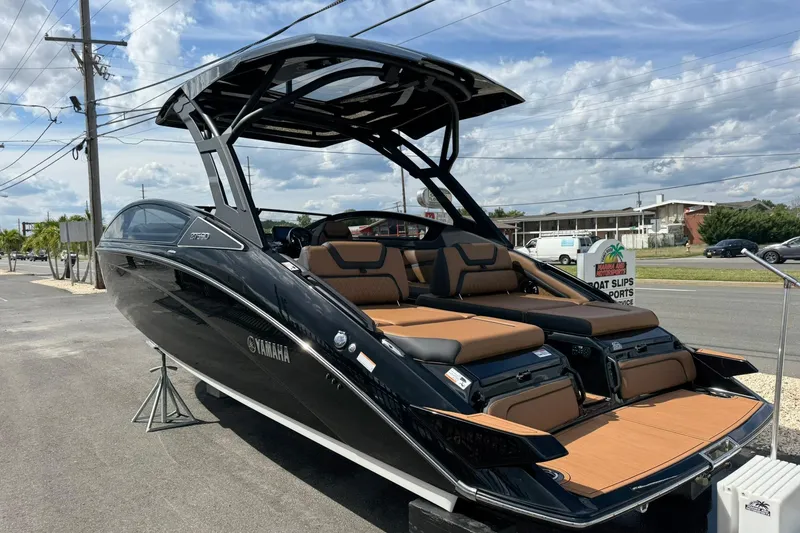 Slide: The Image of Manufacturer Provided Image: 2026 Yamaha Boats 275SD, sleek black design, side view with modern canopy. - 28