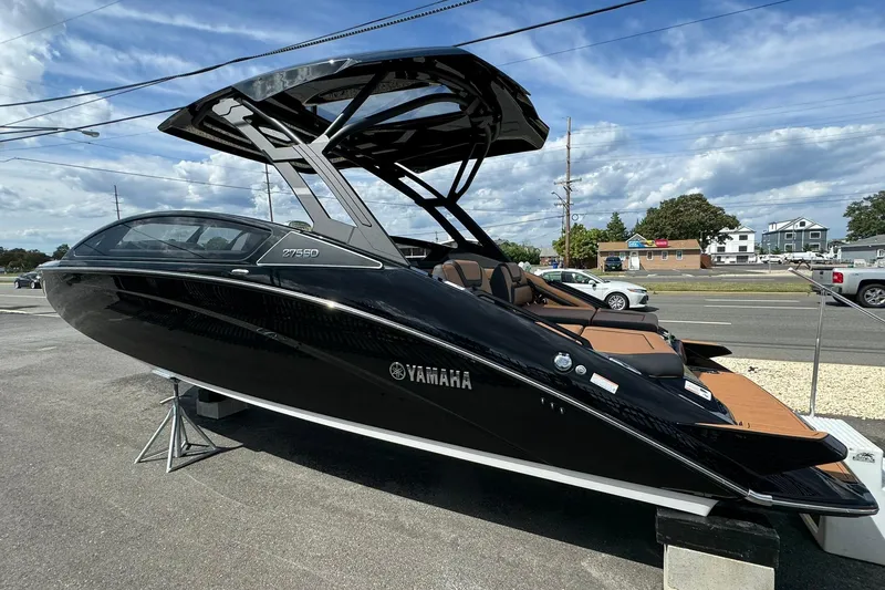 Slide: The Image of 2026 Yamaha Boats 275SD interior with tan leather seating and sleek design. - 8