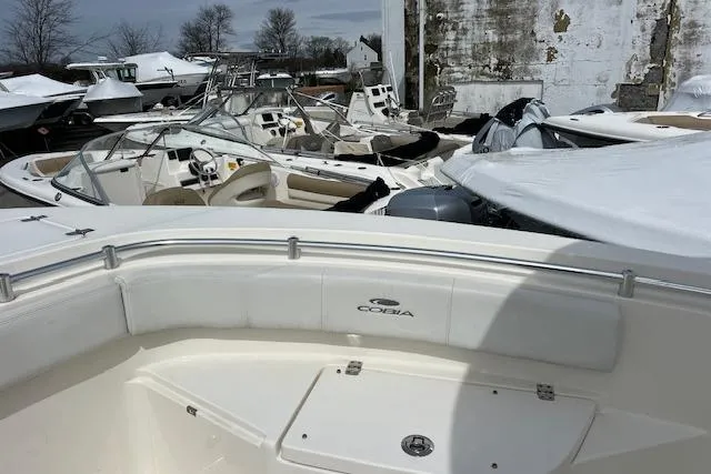 Slide: The Image of 2020 Cobia 237 Center Console boat in storage yard with other vessels. - 15