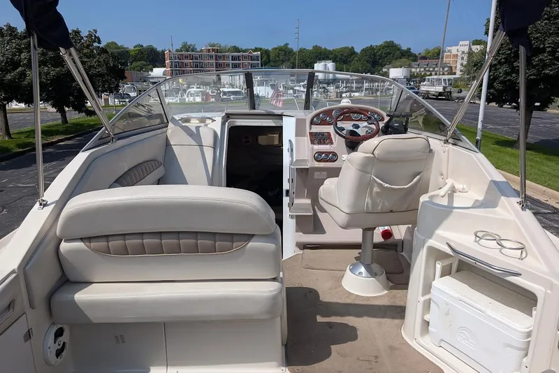 Slide: The Image of 2001 Regal Commodore 2660 boat interior with helm, seating, and storage. - 10