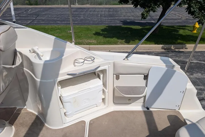 Slide: The Image of 2001 Regal Commodore 2660 boat interior with sink, cooler, and storage compartments. - 14