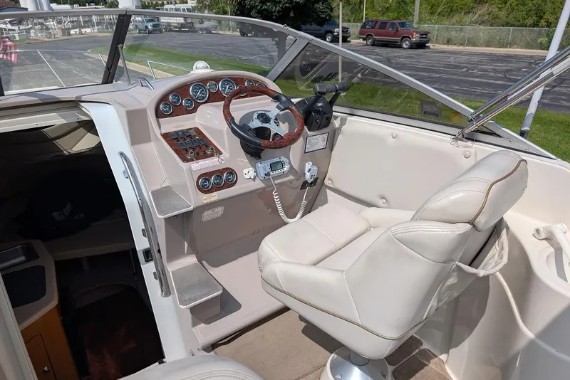 Slide: The Image of 2001 Regal Commodore 2660 boat cockpit with steering wheel and control panel. - 15