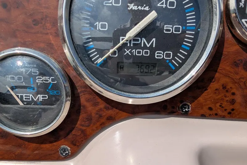 Slide: The Image of Close-up of 2001 Regal Commodore 2660 dashboard gauges, showing RPM and temperature. - 17