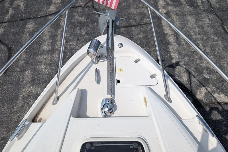 Slide: The Image of 2001 Regal Commodore 2660 boat bow with anchor and railing details. - 25