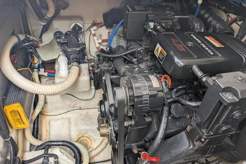 Slide: The Image of Engine compartment of a 2001 Regal Commodore 2660 boat, featuring a Volvo Penta engine. - 48