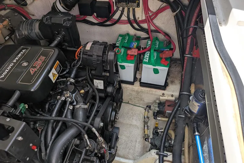 Slide: The Image of Engine compartment of 2001 Regal Commodore 2660 with Volvo Penta 4.3Gi engine and batteries. - 49