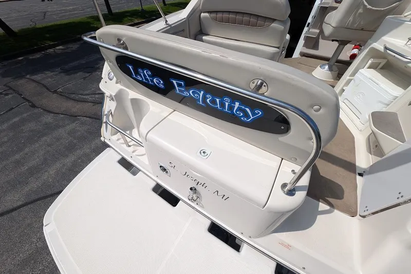 Slide: The Image of 2001 Regal Commodore 2660 boat with "Life Equity" sign, docked in St. Joseph, MI. - 8