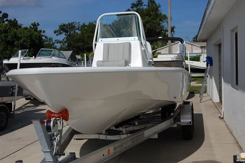 The Image of 2026 Cape Horn 23 Cape Bay boat on trailer, parked outdoors near a building. - 1