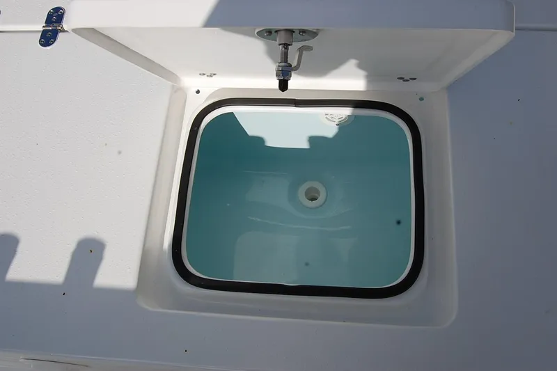 Slide: The Image of Livewell compartment on 2026 Cape Horn 23 Cape Bay boat, open lid view. - 19