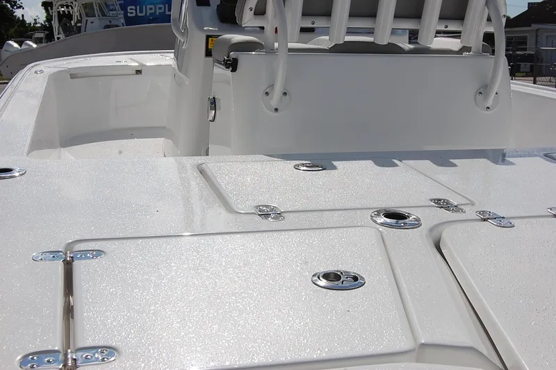 Slide: The Image of 2026 Cape Horn 23 Cape Bay boat deck with storage compartments and seating. - 9