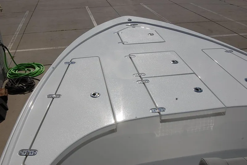 Slide: The Image of 2026 Cape Horn 23 Cape Bay boat deck with storage compartments in a parking lot. - 12