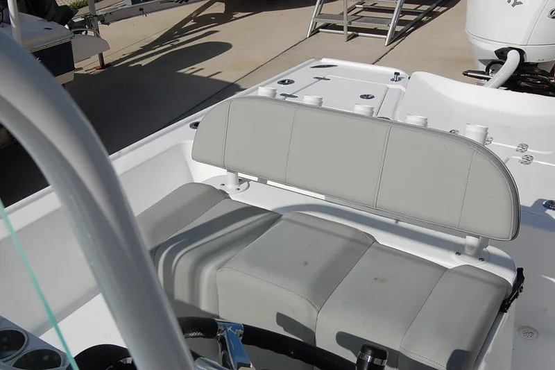 Slide: The Image of 2026 Cape Horn 23 Cape Bay boat interior with gray seating and fishing rod holders. - 13