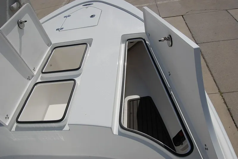 Slide: The Image of 2026 Cape Horn 23 Cape Bay boat storage compartments, open on deck, showcasing spacious design. - 16