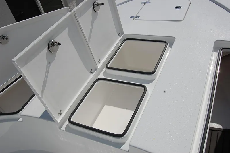 Slide: The Image of 2026 Cape Horn 23 Cape Bay boat storage compartments with open lids. - 17
