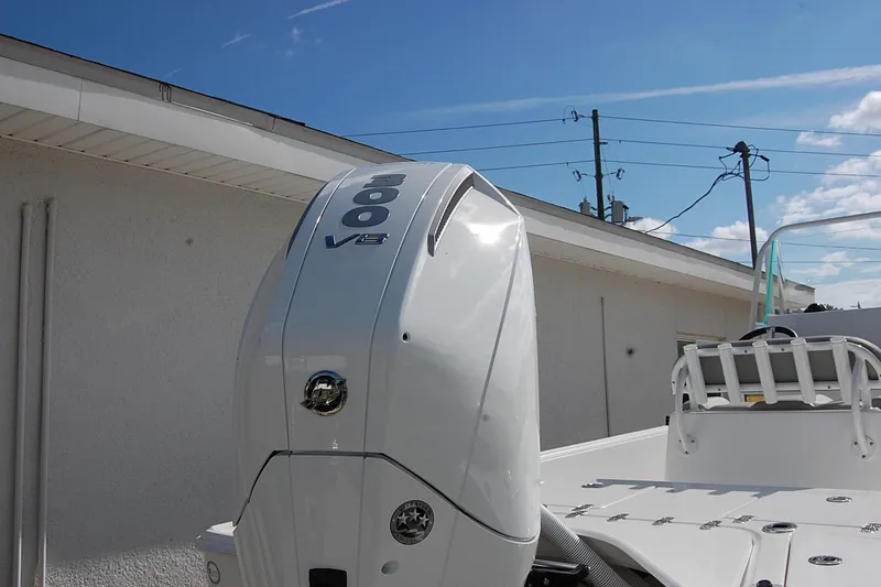 Slide: The Image of 2026 Cape Horn 23 Cape Bay boat with powerful 300 V8 engine, outdoor setting. - 7