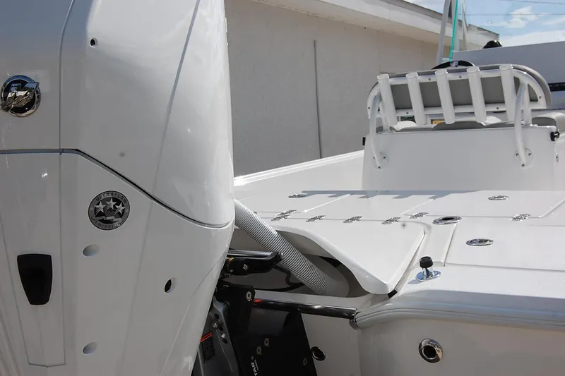 Slide: The Image of 2026 Cape Horn 23 Cape Bay boat, rear view with engine and seating details. - 8