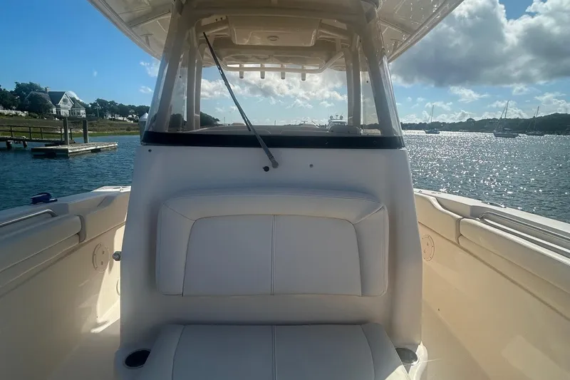 Slide: The Image of 2017 Grady-White Canyon 306 boat on water, sunny day, scenic view. - 11