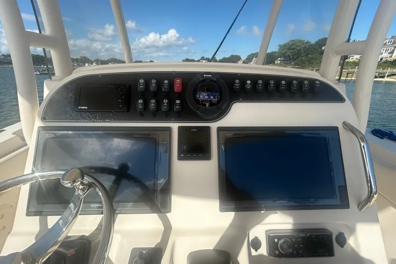Slide: The Image of 2017 Grady-White Canyon 306 helm with dual Garmin displays and Yamaha controls. - 7