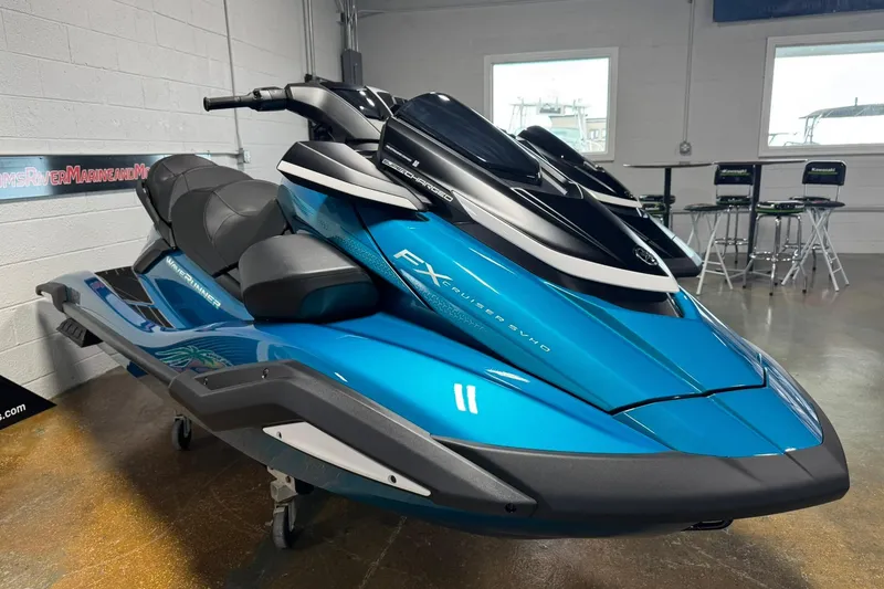 Slide: The Image of 2026 Yamaha WaveRunner FX Cruiser SVHO in showroom, blue and black design. - 3