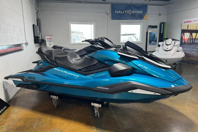 Slide: The Image of 2026 Yamaha WaveRunner FX Cruiser SVHO in showroom, sleek blue design, side view. - 4