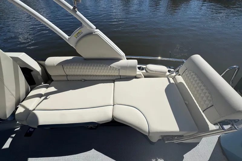 Slide: The Image of 2026 Tahoe Pontoon Grand Tahoe LTD Quad Lounge with luxurious seating on water. - 10