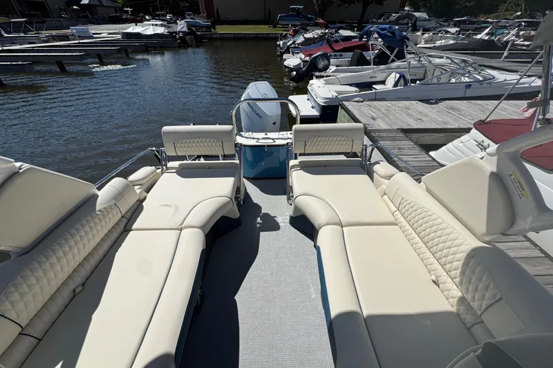 Slide: The Image of 2026 Tahoe Pontoon Grand Tahoe LTD Quad Lounge at marina, showcasing luxurious seating. - 12