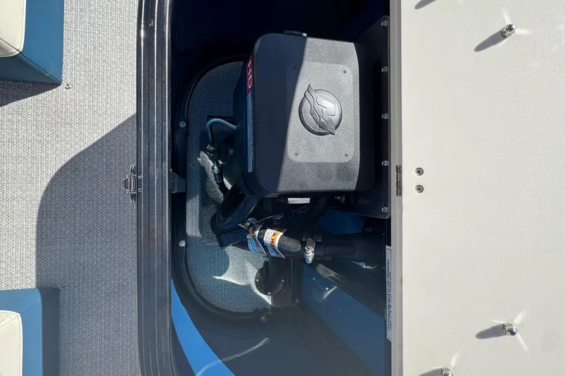 Slide: The Image of 2026 Tahoe Pontoon Grand Tahoe LTD Quad Lounge engine compartment detail. - 13