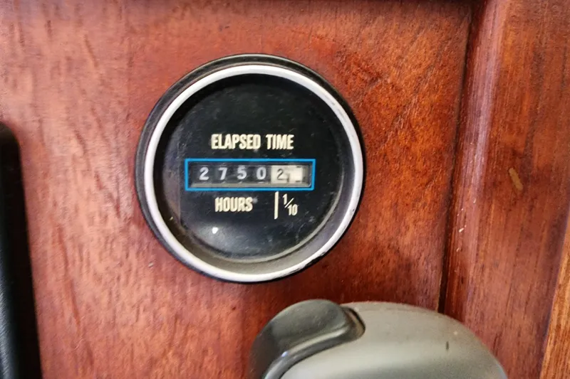 Slide: The Image of Elapsed time gauge on 1989 Marinette 32 Sedan Flybridge, showing 2750.2 hours. - 25