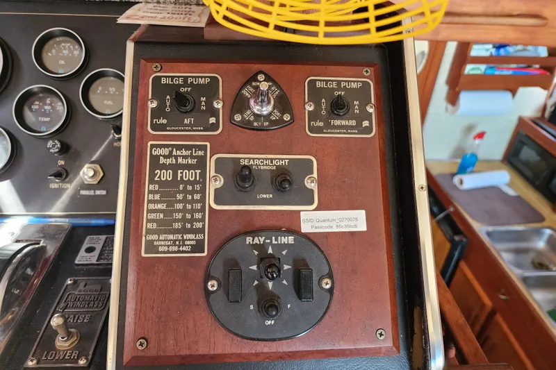Slide: The Image of Control panel of a 1989 Marinette 32 Sedan Flybridge with bilge pump and searchlight switches. - 27
