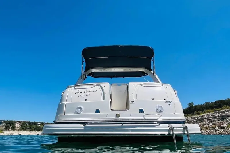 Slide: The Image of 2008 Chaparral 330 Signature boat on water under clear blue sky. - 4