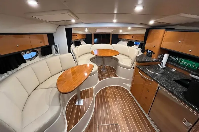 Slide: The Image of Luxurious interior of 2008 Chaparral 330 Signature yacht with elegant seating and kitchenette. - 7