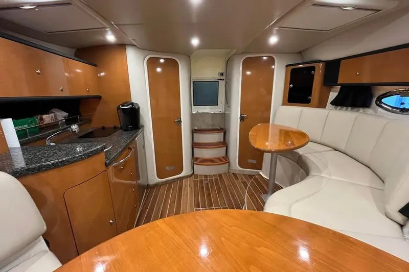 Slide: The Image of Luxurious interior of 2008 Chaparral 330 Signature yacht with wood accents and modern amenities. - 8