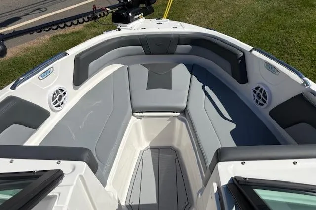Slide: The Image of 2026 Chaparral 21 SSi Ski & Fish boat interior with gray seating and speakers. - 10