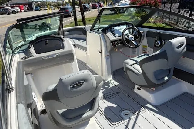 Slide: The Image of 2026 Chaparral 21 SSi Ski & Fish boat interior with gray seating and steering console. - 11