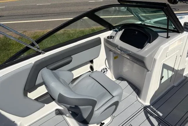 Slide: The Image of 2026 Chaparral 21 SSi Ski & Fish boat interior with gray seating and dashboard. - 7