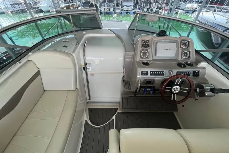 Slide: The Image of 2009 Chaparral Signature 280 boat interior with steering wheel and navigation system. - 6