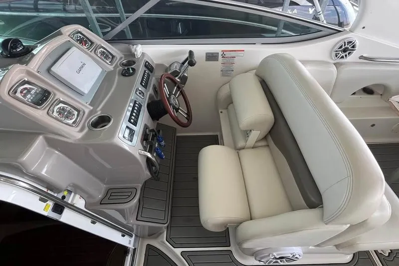 Slide: The Image of 2009 Chaparral Signature 280 helm with Garmin display and plush seating. - 7