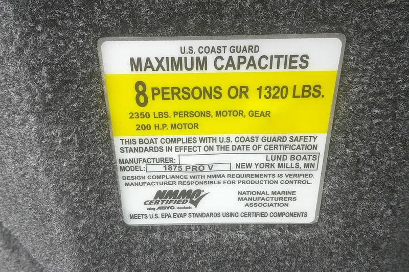 Slide: The Image of U.S. Coast Guard capacity label for 2025 Lund 1875 Pro-V boat, 8 persons or 1320 lbs. - 12