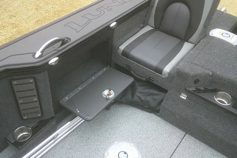 Slide: The Image of 2025 Lund 1875 Pro-V boat interior with seating and storage compartments. - 17