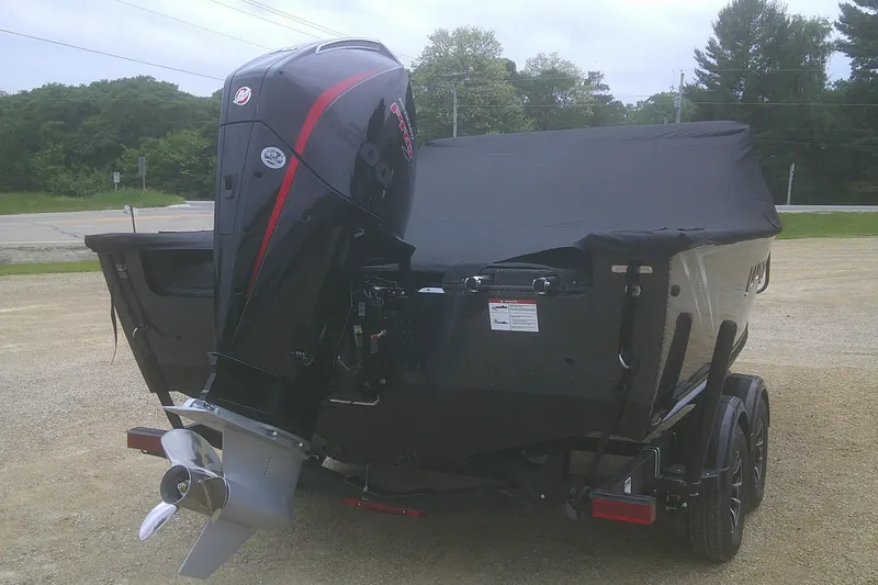 Slide: The Image of 2025 Lund 1875 Pro-V boat with covered deck and powerful outboard motor. - 20