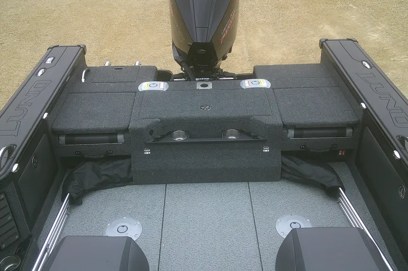 Slide: The Image of 2025 Lund 1875 Pro-V boat interior with seating and storage compartments. - 6